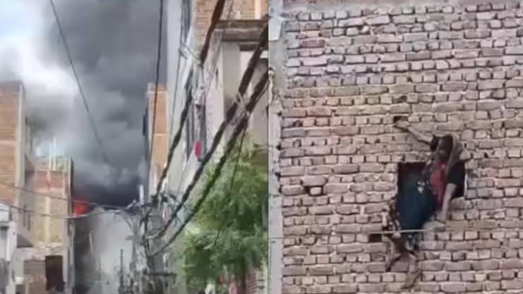 दिल्ली के स्वरूप नगर में फैक्ट्री में आग लगने के बाद इमारत से नीचे कूदते लोग